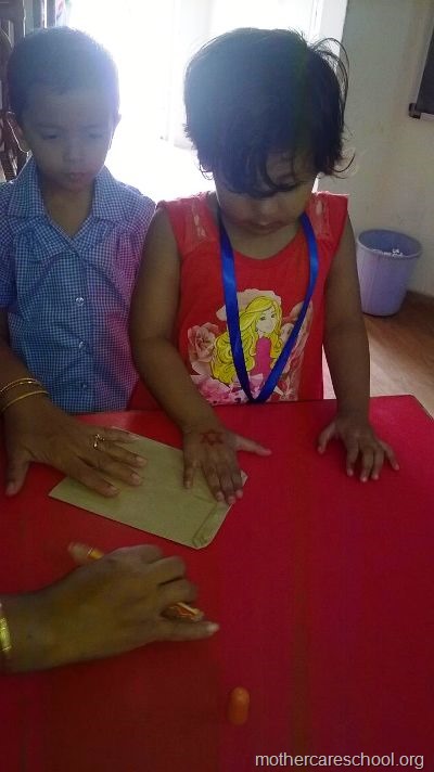 reuse recycle children making newspaper bags